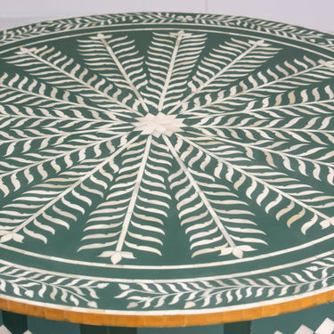 Bone inlay coffee table featuring intricate radial floral pattern in green and white, handcrafted furniture piece
