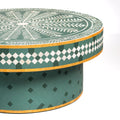 Bone inlay coffee table featuring intricate radial floral pattern in green and white, handcrafted furniture piece