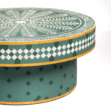 Bone inlay coffee table featuring intricate radial floral pattern in green and white, handcrafted furniture piece