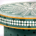 Bone inlay coffee table featuring intricate radial floral pattern in green and white, handcrafted furniture piece