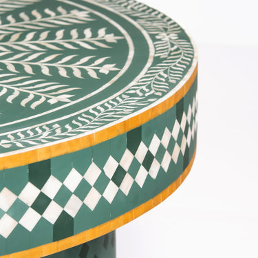 Bone inlay coffee table featuring intricate radial floral pattern in green and white, handcrafted furniture piece