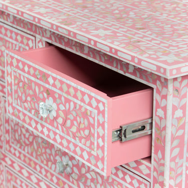 Mother of pearl inlay chest of drawers featuring intricate floral pattern in pink and white, handcrafted furniture piece