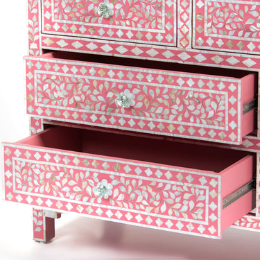 Mother of pearl inlay chest of drawers featuring intricate floral pattern in pink and white, handcrafted furniture piece