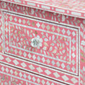 Mother of pearl inlay chest of drawers featuring intricate floral pattern in pink and white, handcrafted furniture piece
