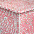 Mother of pearl inlay chest of drawers featuring intricate floral pattern in pink and white, handcrafted furniture piece